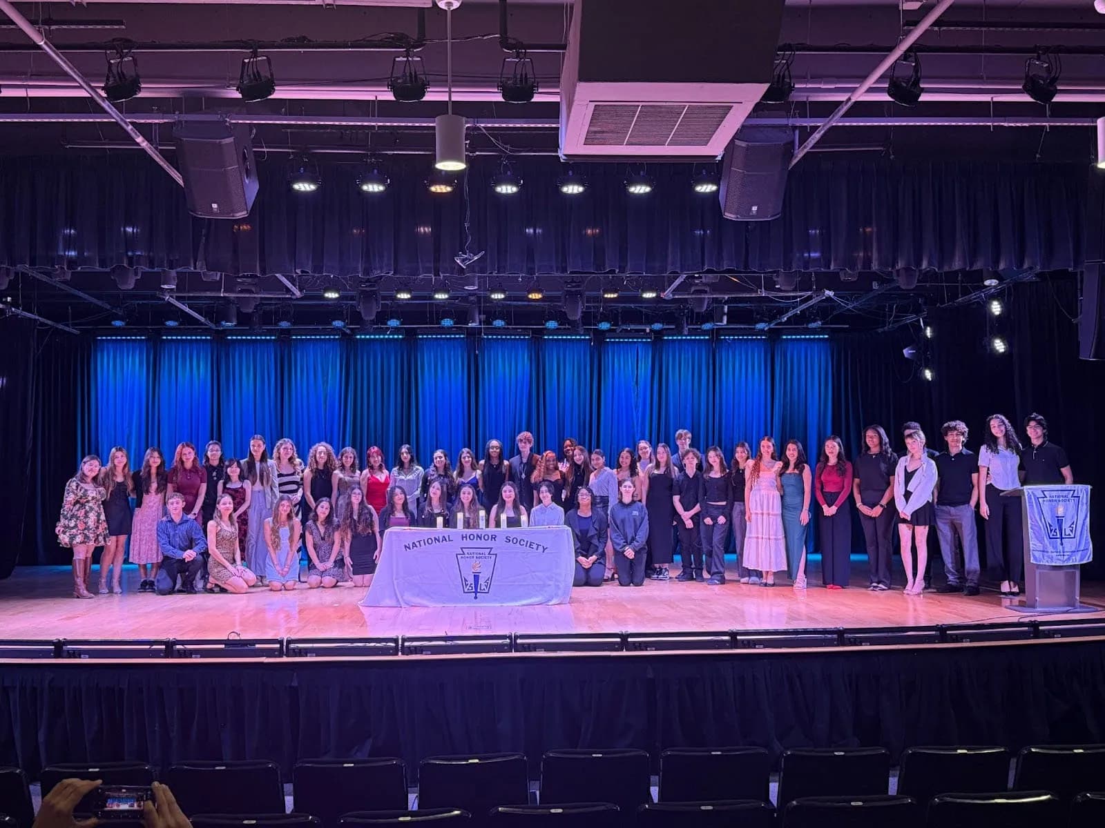 National Honor Society Student group standing on a stage